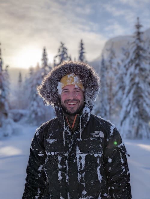 Paul enjoying time outdoors with family in a snowy winter setting